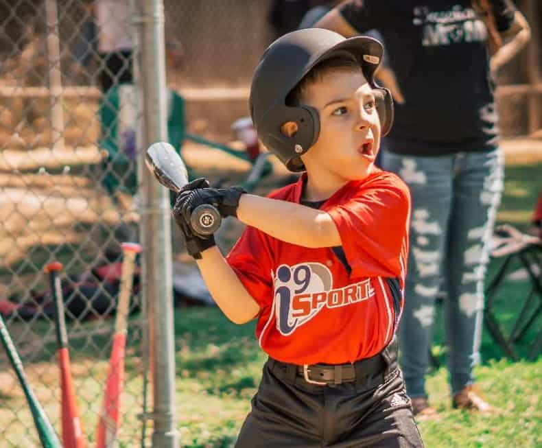 a young boy playing baseball