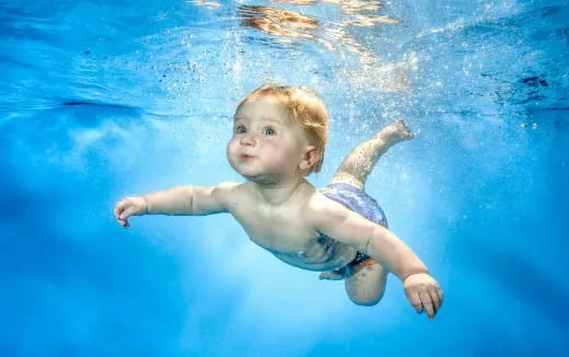 a baby in a pool