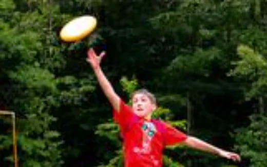 a man throwing a frisbee