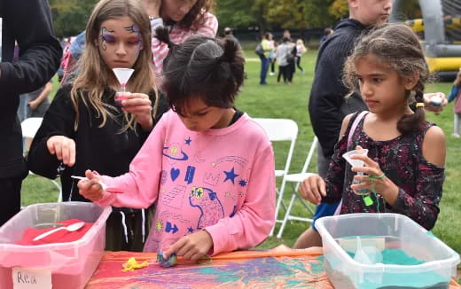 a group of children painting