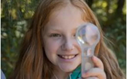 a woman holding a glass