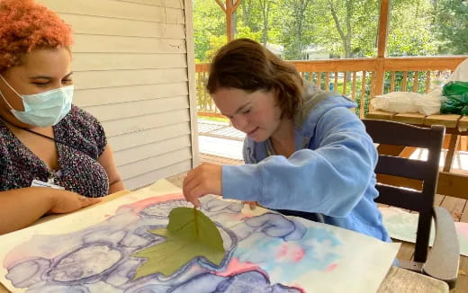 a couple of children painting