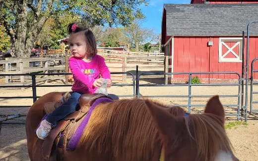 a girl riding a horse