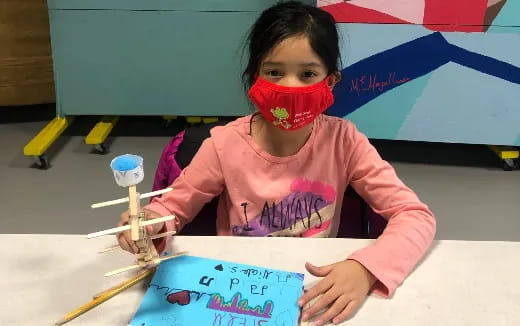 a young girl painting