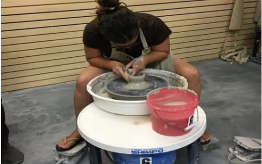 a person washing a bucket