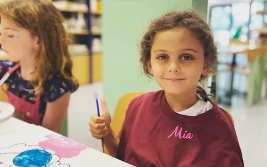 a young girl smiling