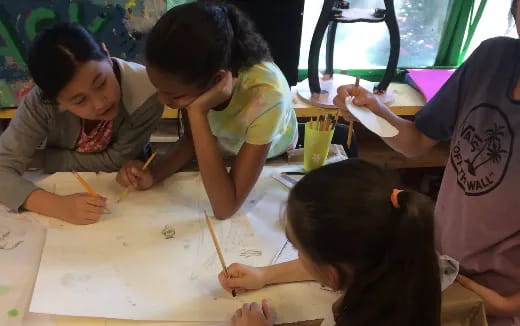 a group of children painting