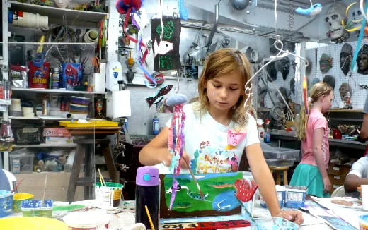 a young girl painting