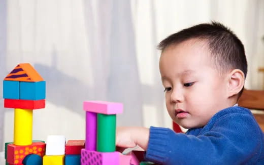 a baby playing with toys