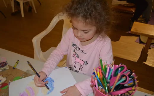 a girl cutting a cake