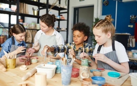 a group of kids painting