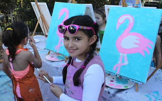 a girl holding a sign