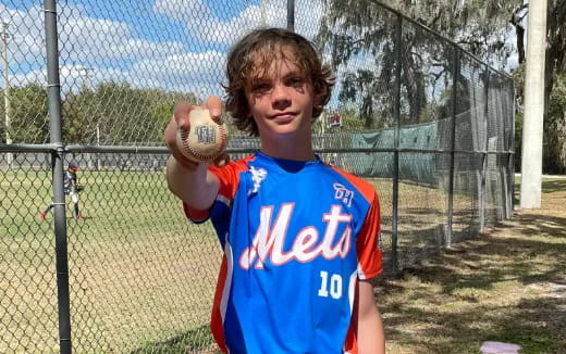 a boy holding a ball