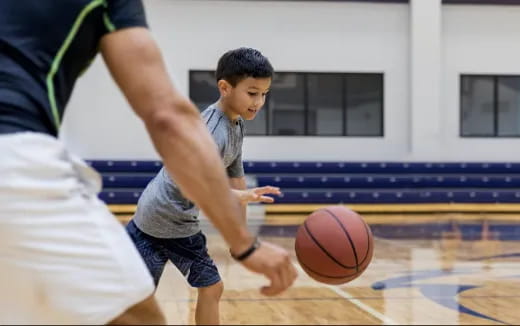 a boy playing basketball