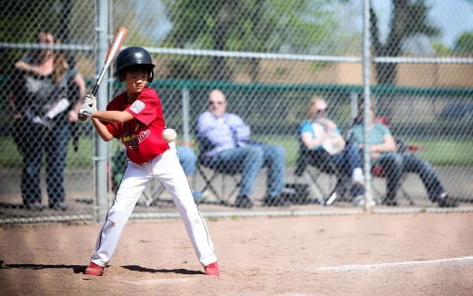 a young boy playing baseball