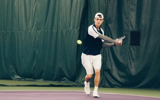 a man playing tennis