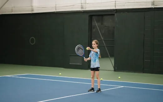 a girl playing tennis