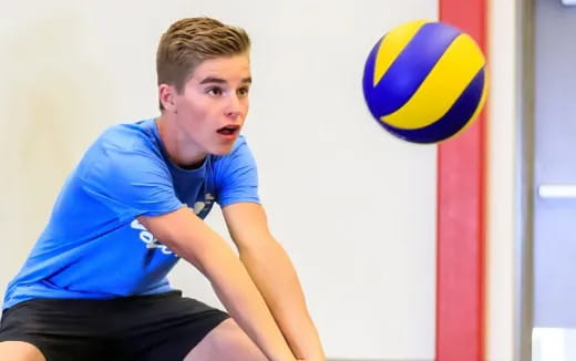 a woman playing volleyball