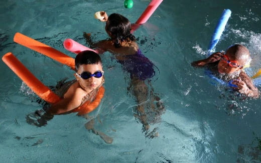 a group of people swimming