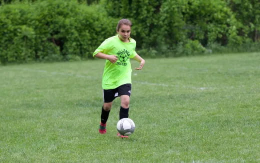 a girl playing football