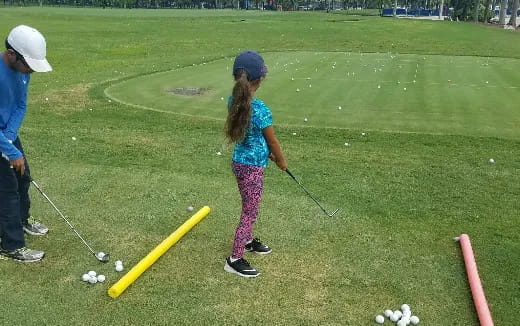 a girl playing golf