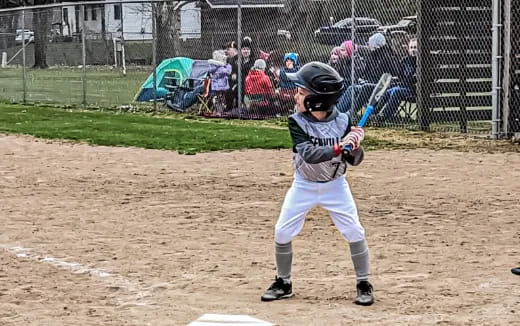 a young boy playing baseball