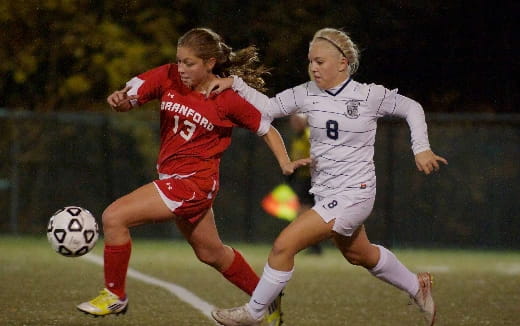 two women playing football