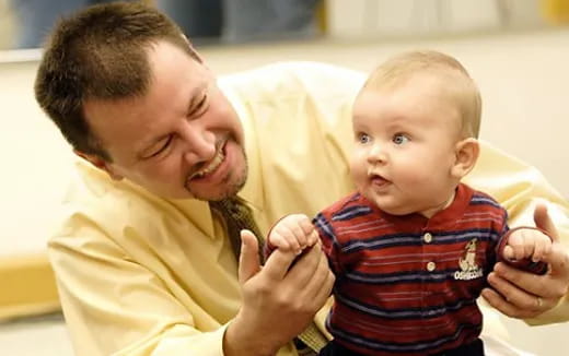 a person holding a baby