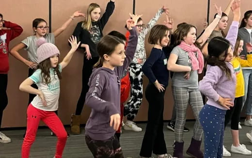 a group of children dancing