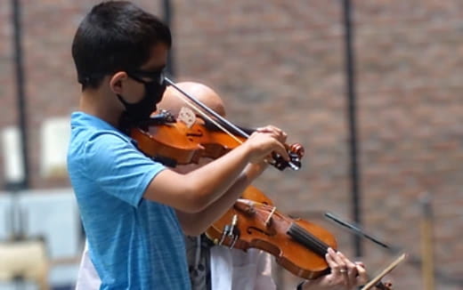 a person playing a violin