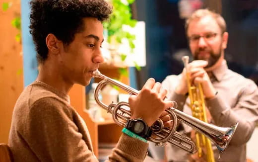 a man playing a trumpet