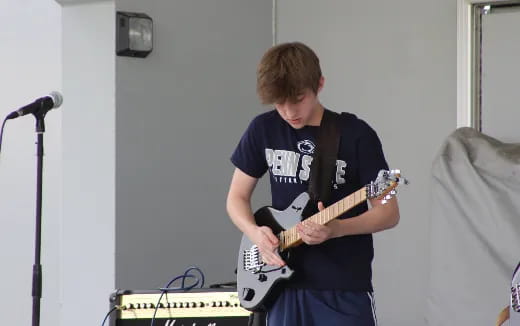 a man playing a guitar