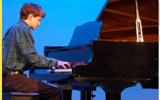 a man playing a piano