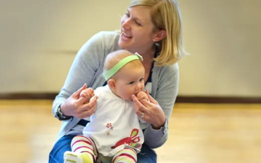 a person holding a baby