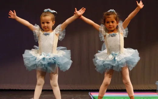 a couple of girls dancing