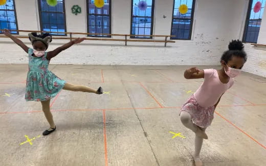 a couple of children dancing