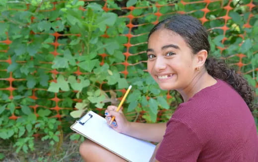 a person holding a pencil