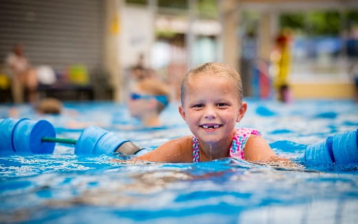 a boy in a pool