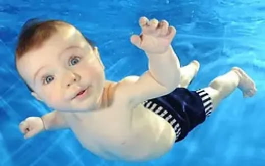 a baby swimming in water