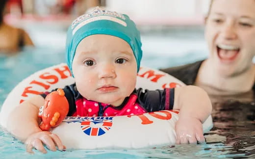 a baby in a pool