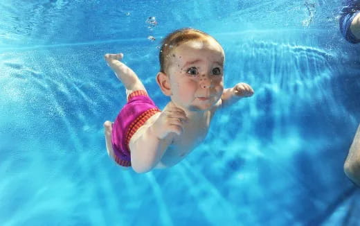 a baby in a pool