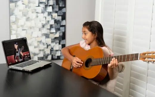 a person playing a guitar