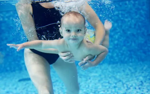 a baby in a pool