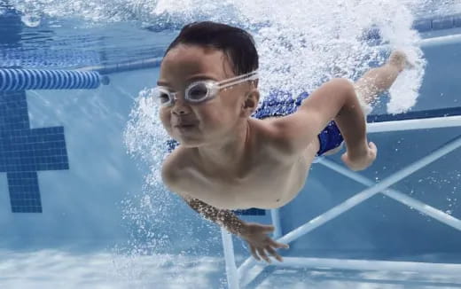 a boy in a pool