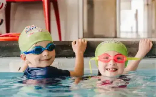 two kids in a pool