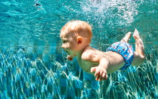 a baby in a pool