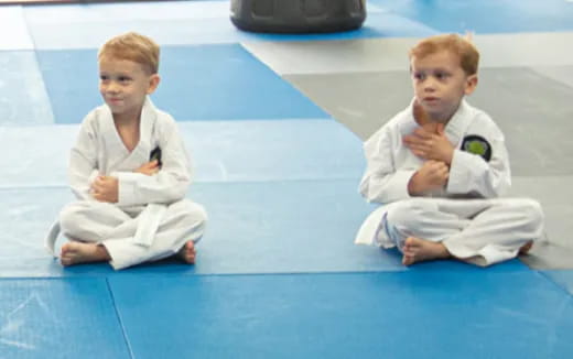 two boys in karate uniforms