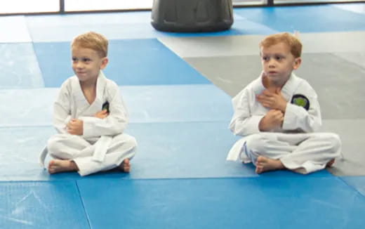 two boys in karate uniforms