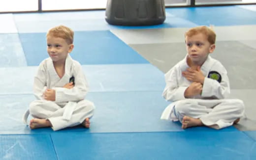 two boys in karate uniforms