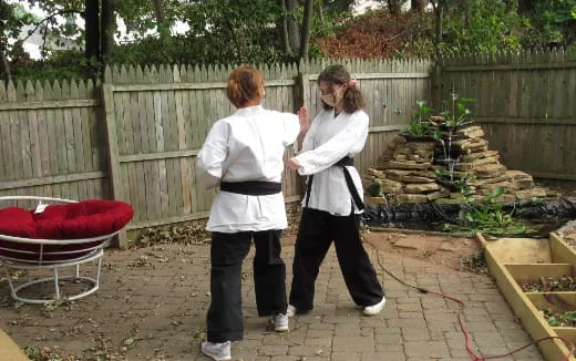 two women standing outside